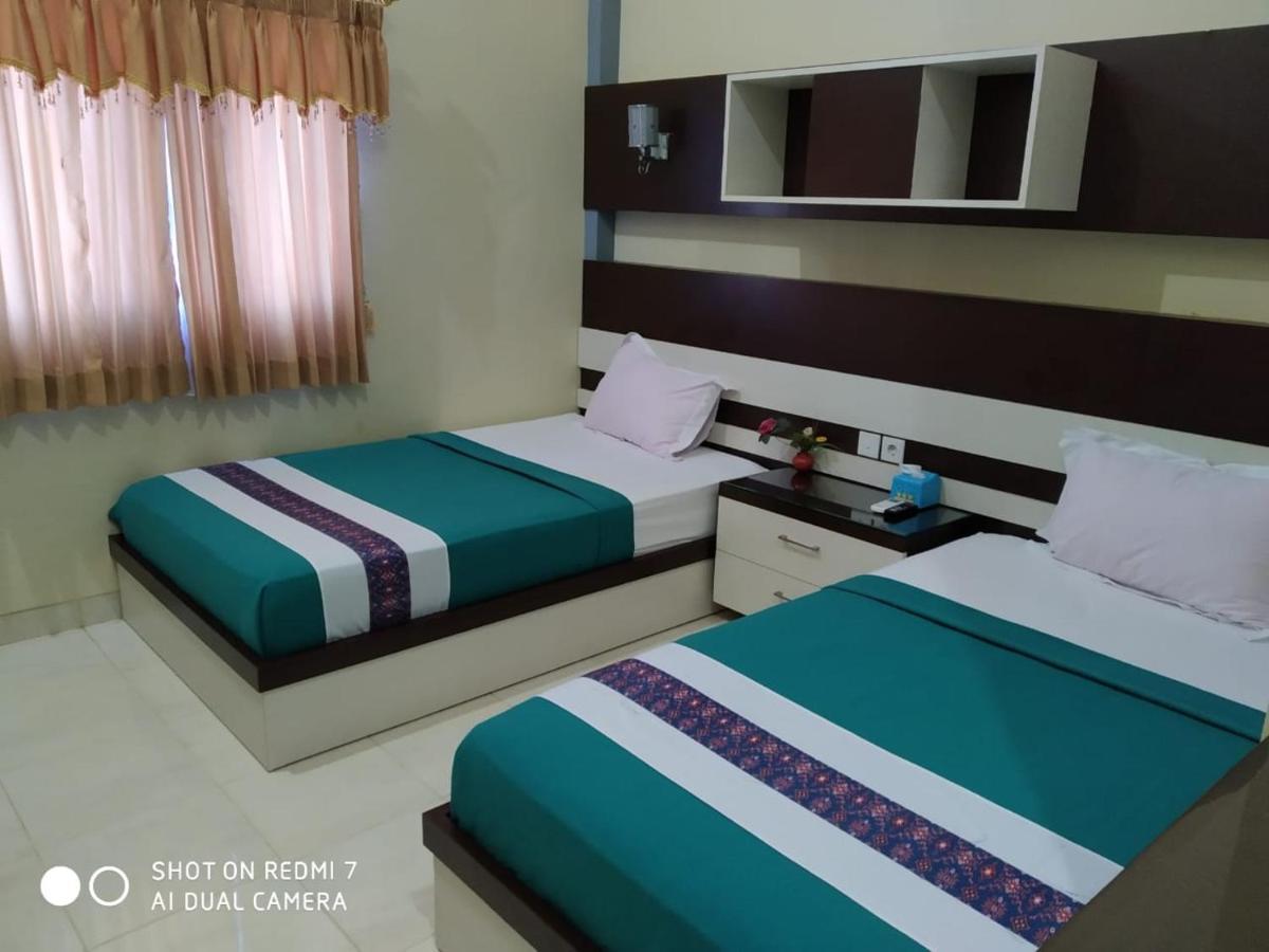 Hotel Pilar Mosa Muarawahau Buitenkant foto