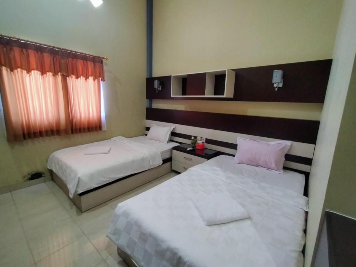 Hotel Pilar Mosa Muarawahau Buitenkant foto